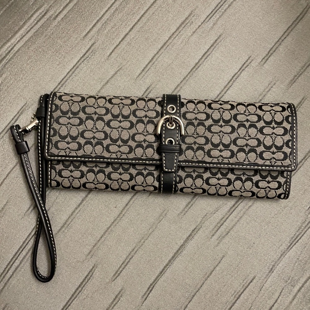 Black logo Coach mini wristlet wallet